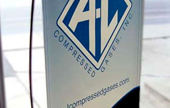Sign Banner: A-L Compressed Gasses, Inc.