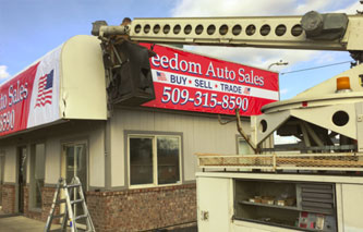 Banner Installation: Freedom Auto Sales